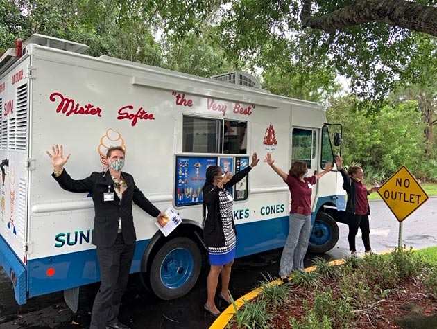 VITAS Rep Chad Adcock stands by the Mister Softee truck and welcomes healthcare workers to get a treat