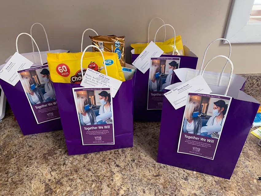 Five goody bags with candy and other treats inside