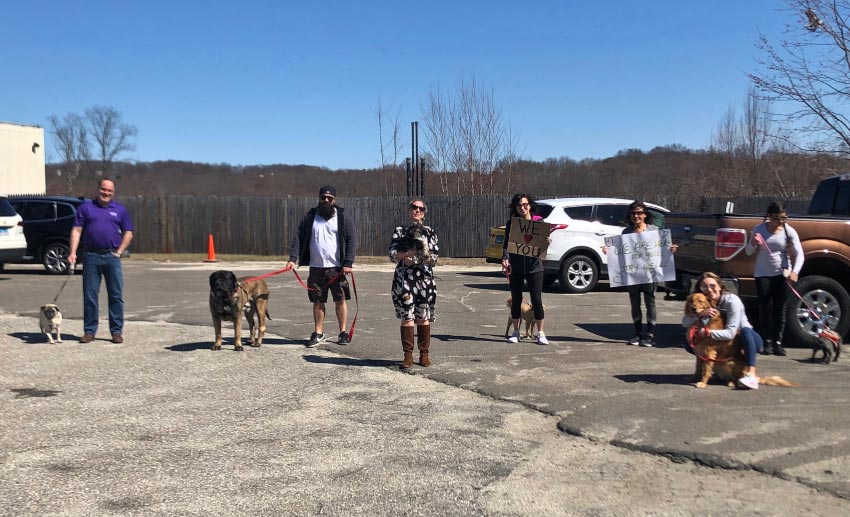 The VITAS team with their pets outside a Connecticut assisted living facility