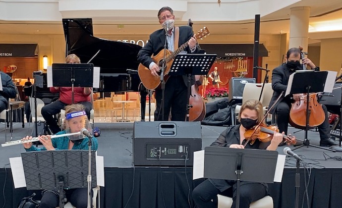 Tom Dalton plays guitar with Symphony of the Americas