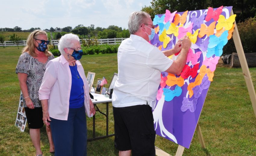 A board with butterfly-shaped cutouts to write names onto