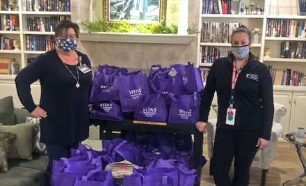 Carole and Jamie pose with the care packages they assembled