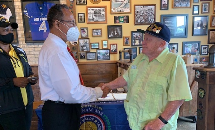 Fred greets a fellow veteran at Mission BBQ