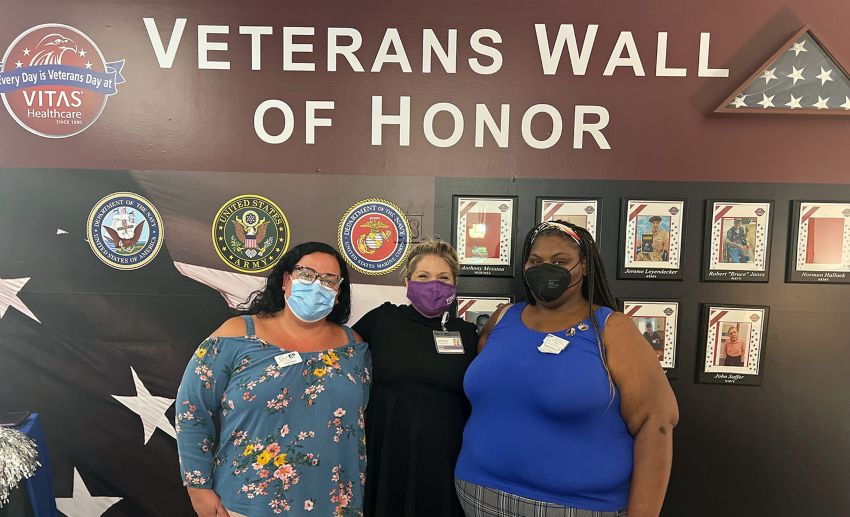 Leaders from Charter at the veterans wall