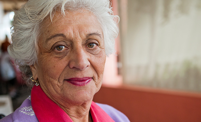 An older Jewish woman smiles