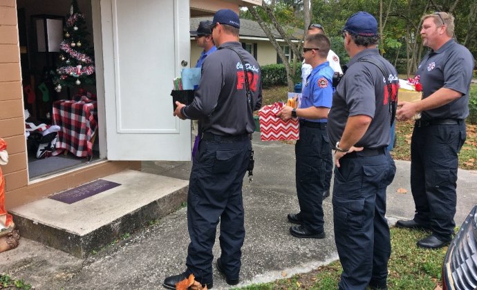 A group of firefighters with boxes of Christmas cards for Nicholas