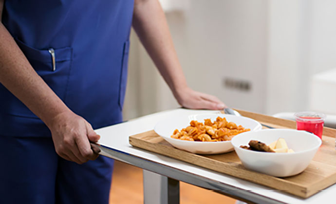 A healthcare worker with food