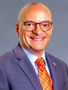 Professional headshot of Larry Hetu-Robert