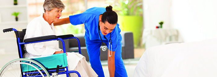 HCP assisting patient in wheelchair