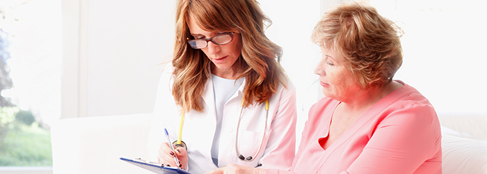 Healthcare professional shows patient info on clipboard