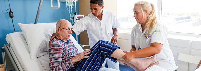 Patient receiving care from two professionals