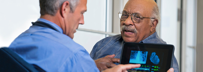 Physician reads results of test to patient