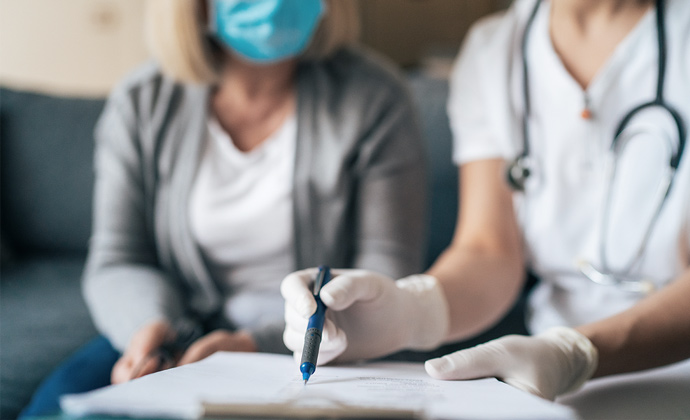 A clinician shows information to a patient's caregiver