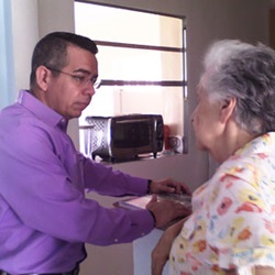 A hospice chaplain with a hospice patient