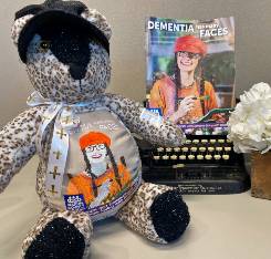 A Memory Bear and magazine cover honoring a VITAS patient