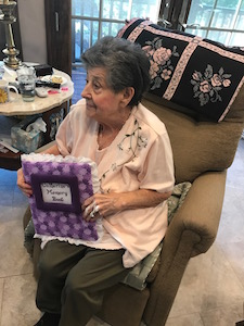 Hospice patient Catherine with a memory book